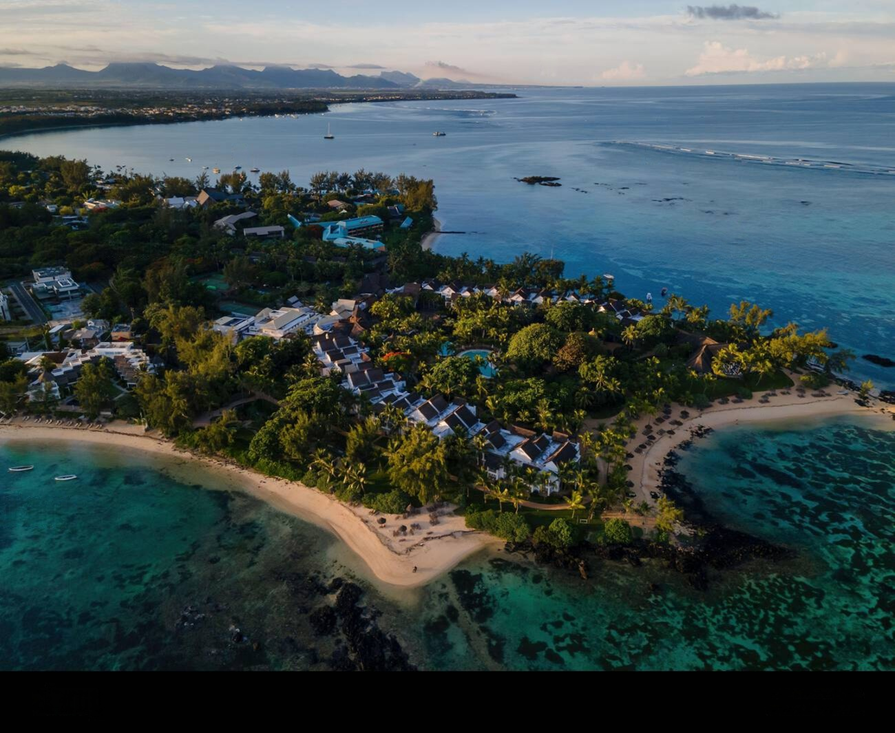 Aerial view of Pointe aux Canonniers coastline in Mauritius at sunset